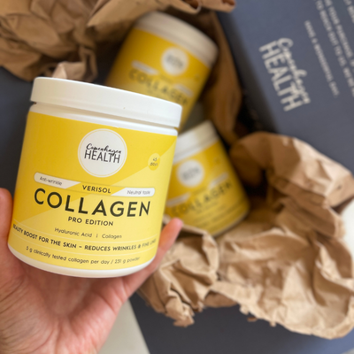 Product photography of Copenhagen Health collagen supplement in an aesthetic beauty and wellness setting.