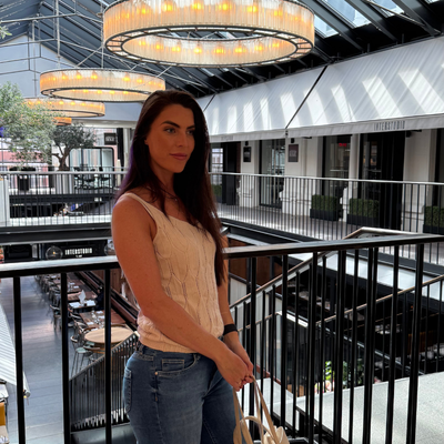 Female content creator posing in a styled fashion look for lifestyle content.